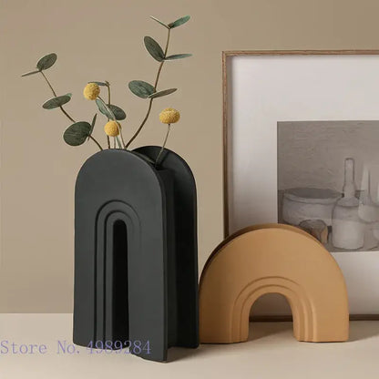 Black ceramic vase with geometric stripes vertical grooves holding greenery and yellow flowers for living room decorbites geometric stripes ceramic