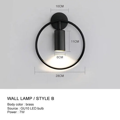 Minimalist gold adjustable angle wall light with black circular lamp and brass-finished base by decorbites wall light