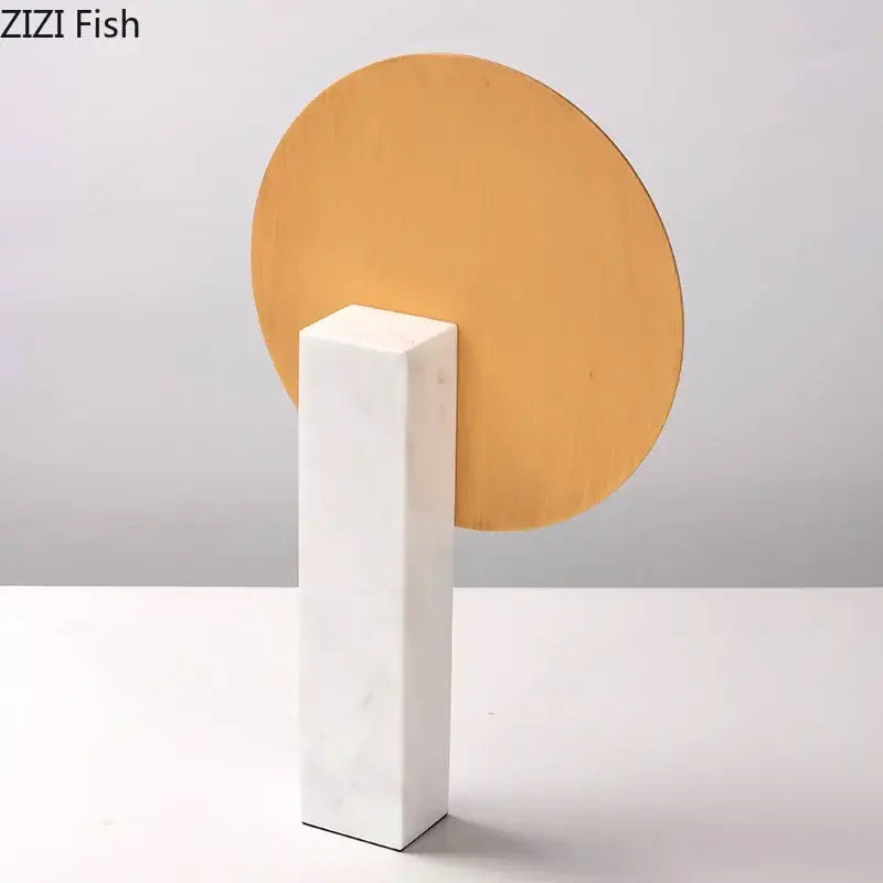 Minimalist white marble bookend with circular gold-toned disc for elegant desk decoration with marble base