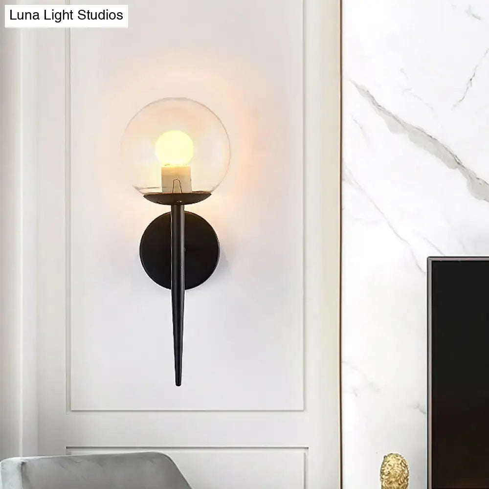 Minimalist gold and black metal pencil arm wall sconce with clear glass globe and warm bulb for living room inch fixture