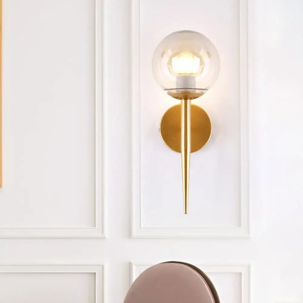 Minimalist gold and black clear glass wall sconce with pencil arm and clear glass globe for living room inch fixture