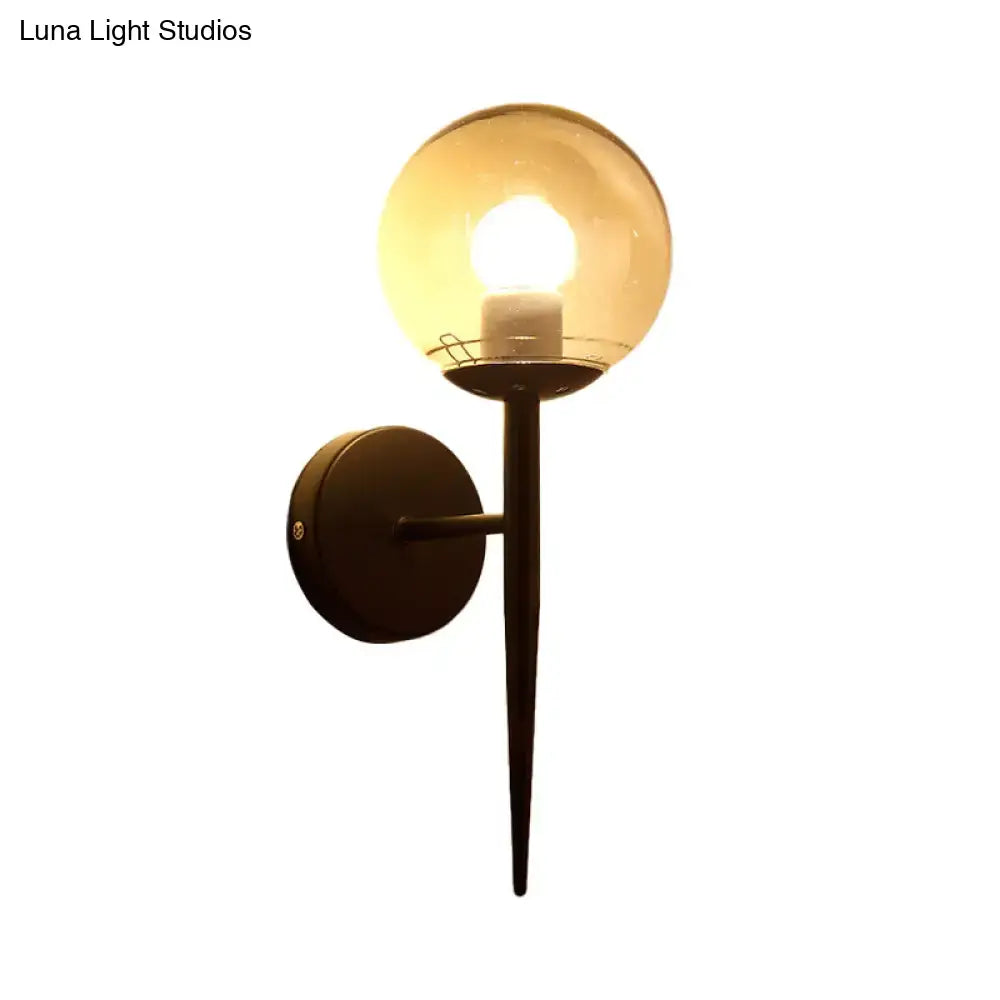 Minimalist gold and black clear glass wall sconce with warm-toned spherical globe and pencil arm for e26 e27 bulbs