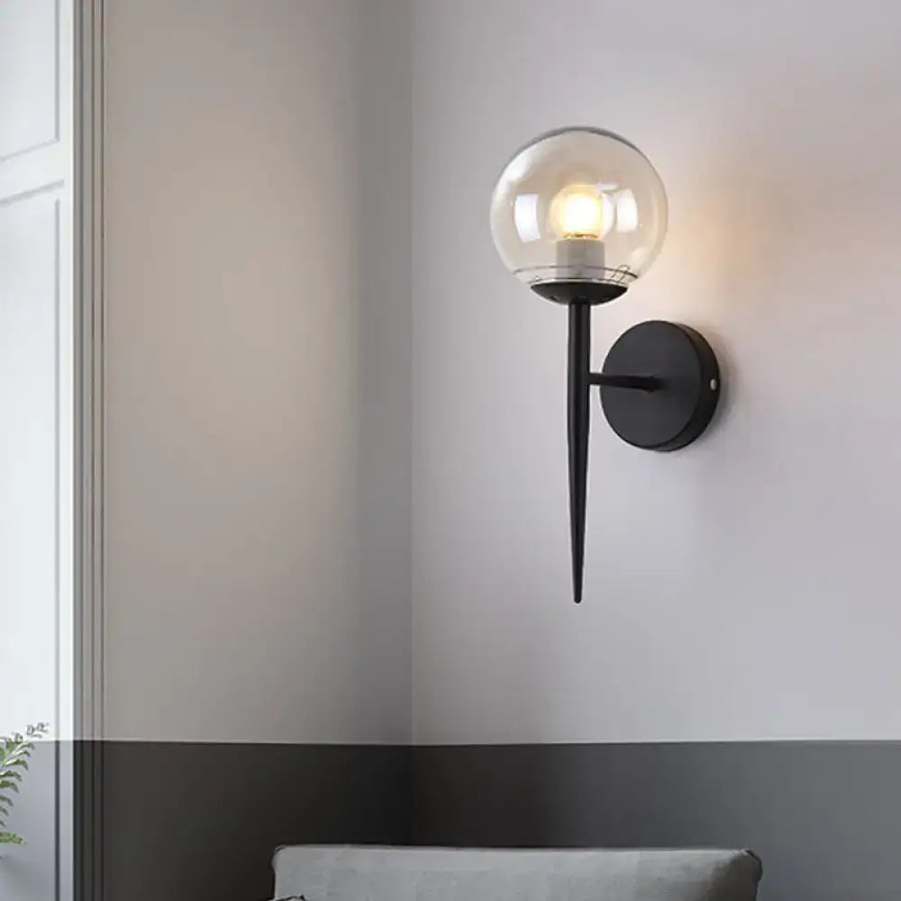 Black metal pencil arm wall sconce with clear glass globe and gold accents for living room inch fixture lighting