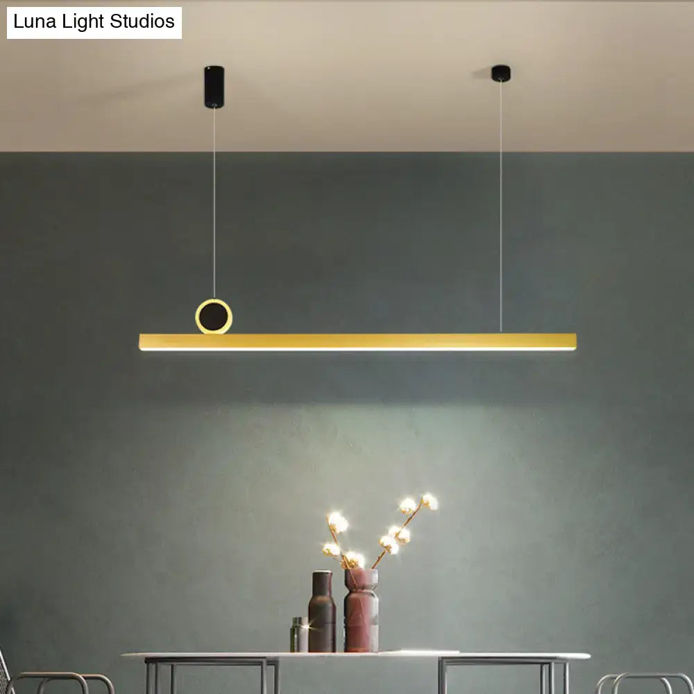 Modern gold-toned linear pendant ceiling light with circular accent featuring gear color temperature for stylish minimalism