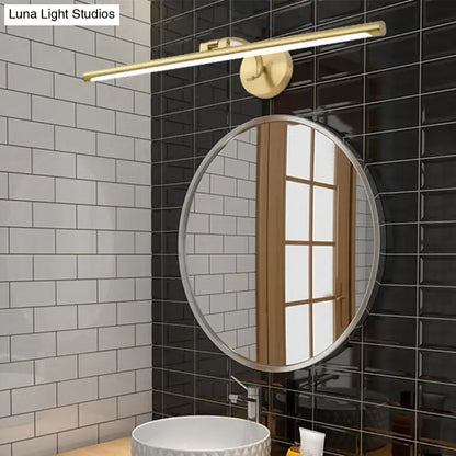 Minimalist gold brass led sconce bathroom vanity light with sleek elongated bar design mounted above round mirror