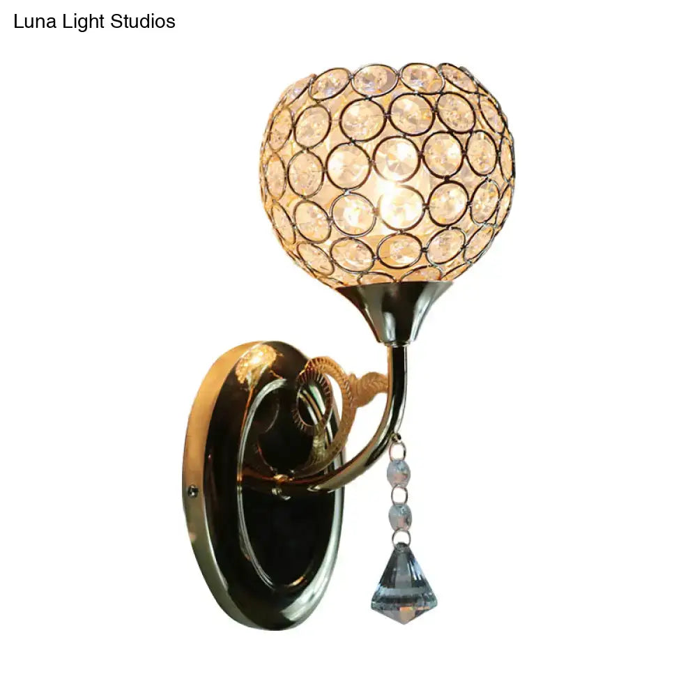 Minimalist gold-toned wall sconce with spherical crystal globe and faceted teardrop pendant e26 e27 light fixture