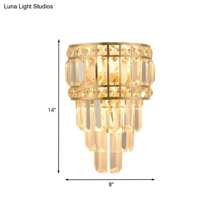 Gold-toned minimalist wall lamp with cascading crystal prisms 3-light 12 inch fixture for living room lighting