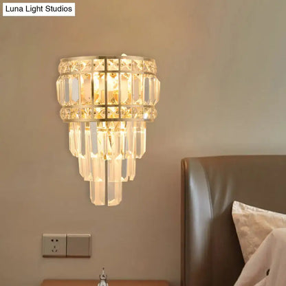 Minimalist gold crystal wall lamp with cascading clear prisms in tiered rows 3-light 12 inch fixture for living room
