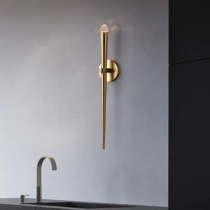 Minimalist gold crystal wall sconce with sleek elongated design and clear crystal accent for bedroom decorbites crystal minimalist decor