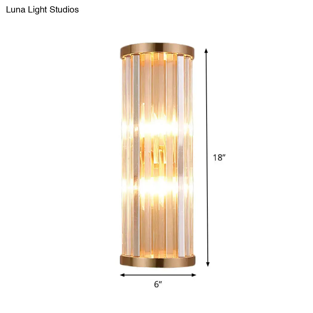 Minimalist gold crystal wall sconce with brushed gold finish and vertical rods emitting warm light for e12 e14 bulbs