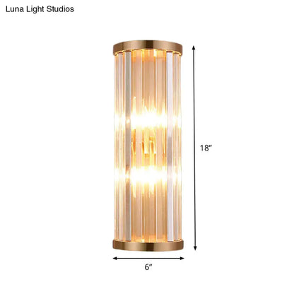 Minimalist gold crystal wall sconce with brushed gold finish and vertical rods emitting warm light for e12 e14 bulbs