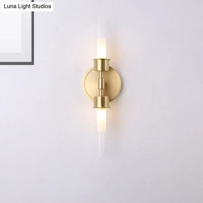 Brass-finished minimalist gold double cylinder wall sconce with two glass rods warm light 10 inch fixture