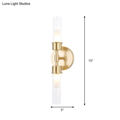 Minimalist gold double cylinder wall sconce 15 inch fixture with brushed brass finish and frosted glass cylinders for bedroom