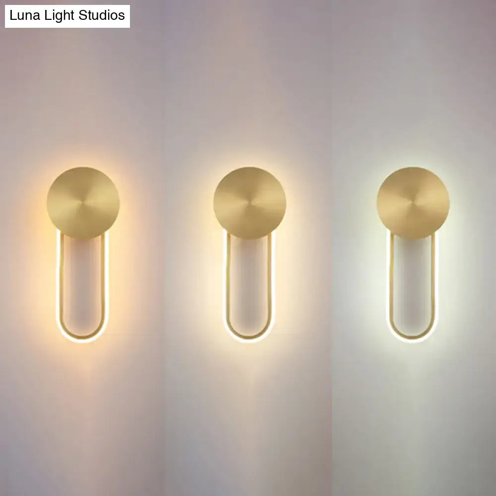Minimalist gold elliptical wall sconce light with circular top and curved led strips for modern bedroom lighting