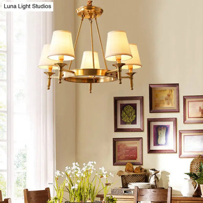 Minimalist gold fabric bedroom conical ceiling chandelier with brass frame and five cream-colored lampshades