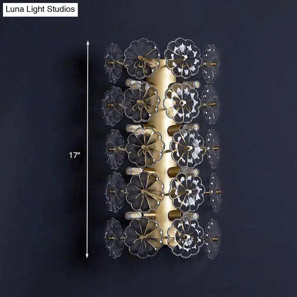 Minimalist gold floral crystal sconce light with clear flower-shaped glass elements arranged in vertical rows for bedroom