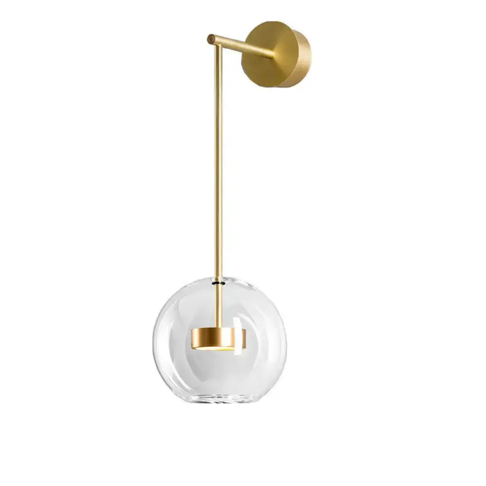 Minimalist gold wall hanging light with clear glass globe and minimalist design for bedroom sconce lighting