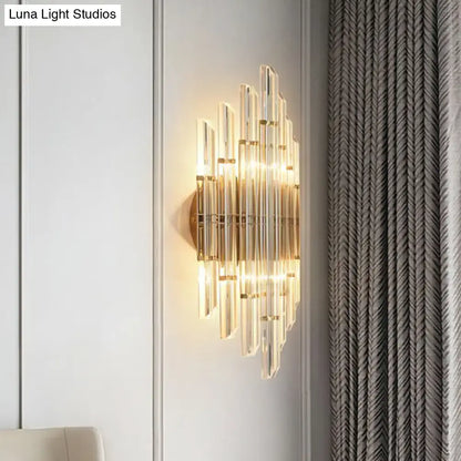 Minimalist gold k9 crystal wall sconce light with radial clear crystal rods in a sunburst pattern for living room