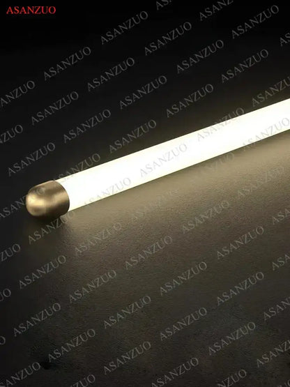 A minimalist gold led strip pendant light with a sleek illuminated fluorescent tube and metallic end cap for dining room decorbites led strip