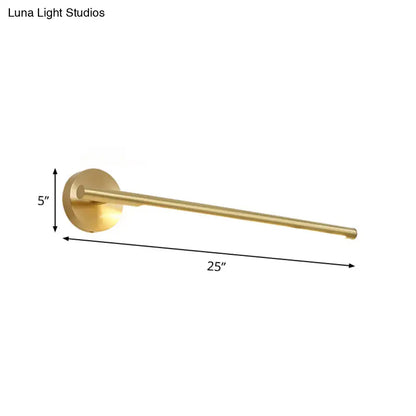 A sleek 25-inch brass towel rack with circular wall-mounted base paired with gold led wall light acrylic diffuser