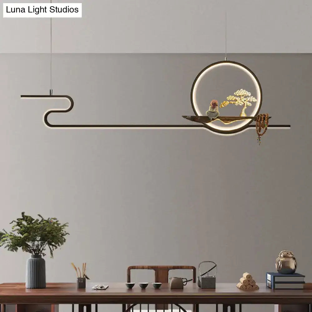 Minimalist gold linear hanging lamp with black frame circular ring and wooden bonsai tree platform for study room lighting