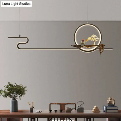 Minimalist gold linear hanging lamp with black frame circular ring and wooden bonsai tree platform for study room lighting
