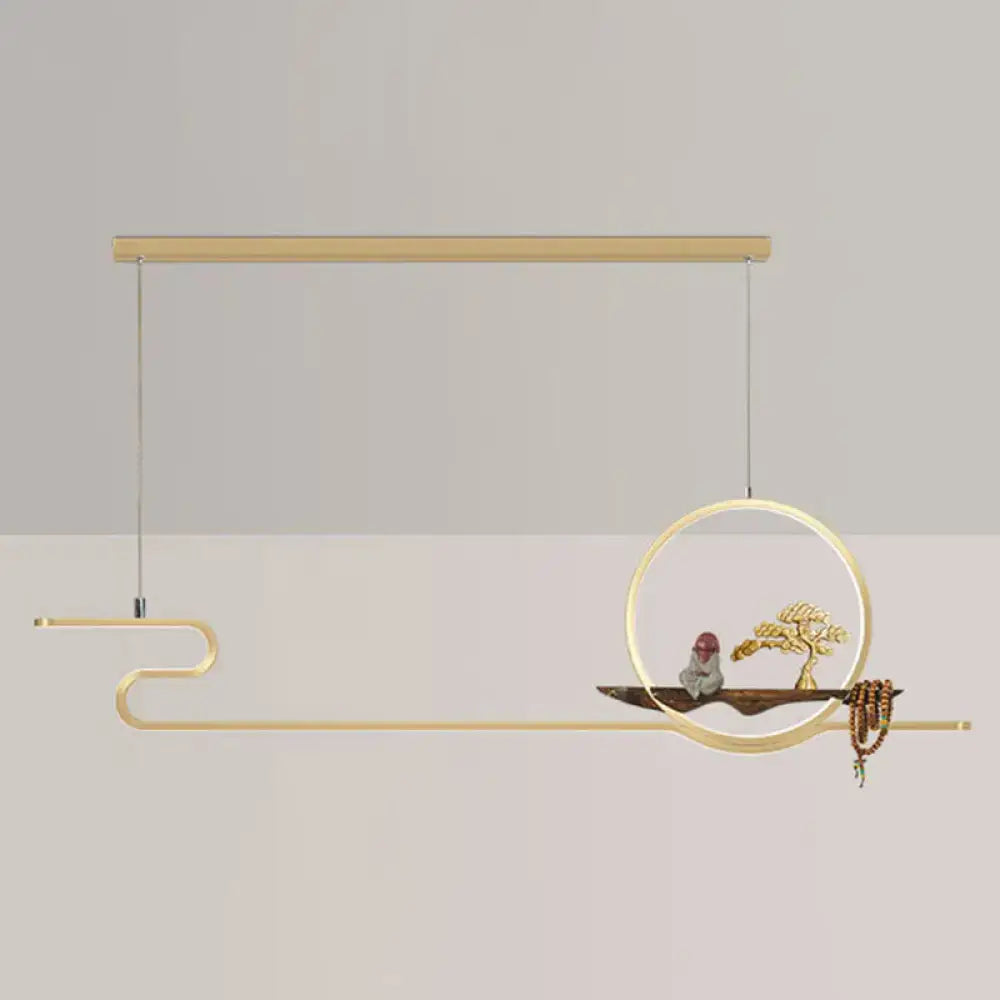 Modern gold-toned linear hanging lamp with abstract circular frame, curved arms, and bonsai tree design for study room