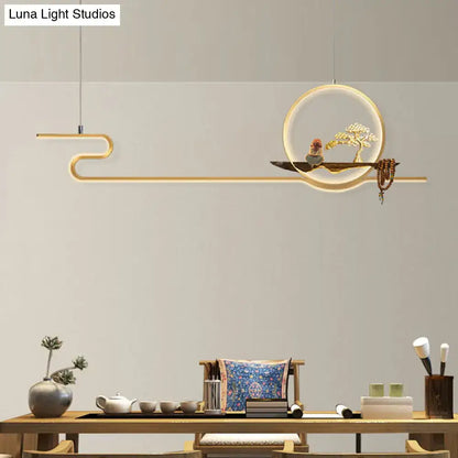 Minimalist gold linear hanging lamp with circular frame, sculpted bonsai tree, and adjustable chain cord length for study room