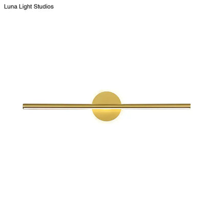 Minimalist gold linear led wall sconce with a sleek horizontal bar and circular base modern wall sconce for bedroom vanity lighting