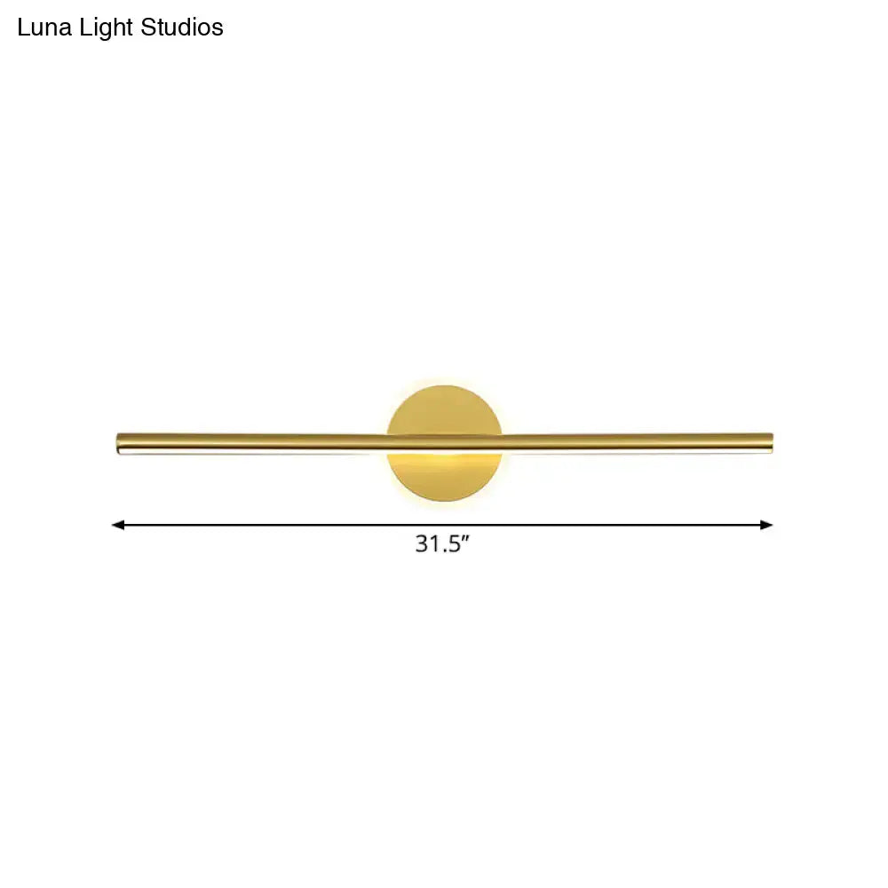 Minimalist gold linear led modern wall sconce with a sleek horizontal bar and circular backplate for vanity lighting