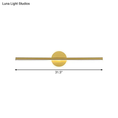Minimalist gold linear led modern wall sconce with a sleek horizontal bar and circular backplate for vanity lighting