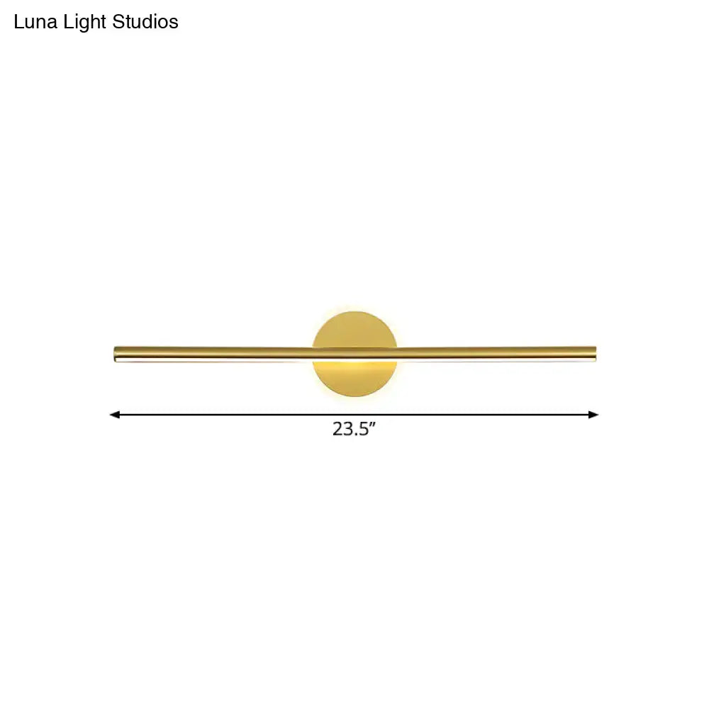 Minimalist gold linear led wall sconce with a gold-toned sleek horizontal bar and circular light fixture modern wall sconce