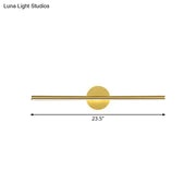 Minimalist gold linear led wall sconce with a gold-toned sleek horizontal bar and circular light fixture modern wall sconce