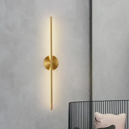 Minimalist gold linear led wall sconce lamps with a sleek vertical rod and circular base for bathroom lighting