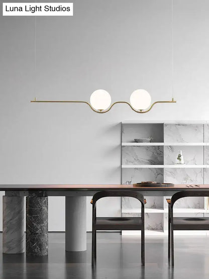 Minimalist gold metal island pendant ceiling light with two white glass shades for dining table illumination