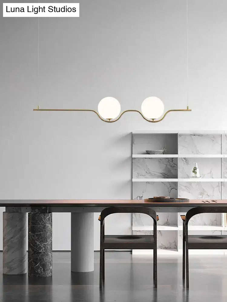 Minimalist gold metal island pendant ceiling light with two white glass shades for dining table illumination