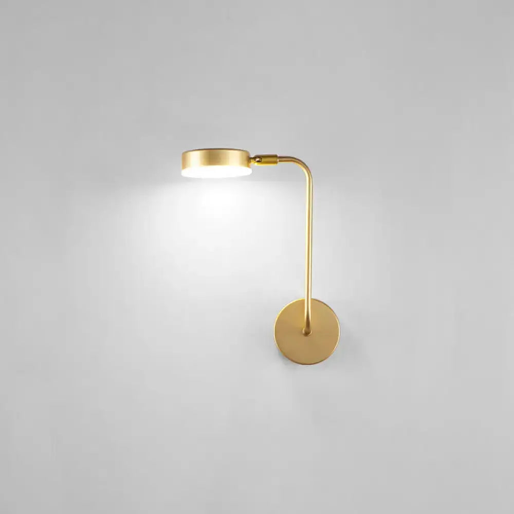 Minimalist gold metal led sconce wall mounted lamp with sleek curved arm and circular base for bedroom use