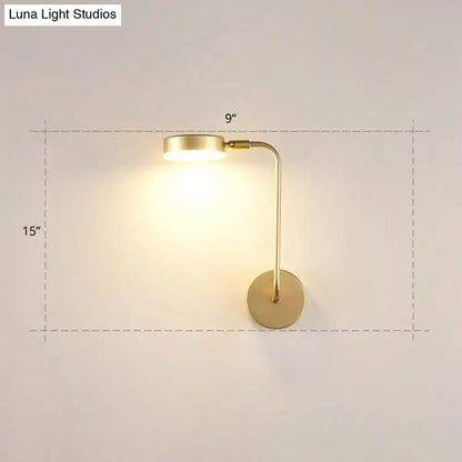 Minimalist gold metal led sconce wall mounted lamp with sleek curved arm and circular base for bedroom use