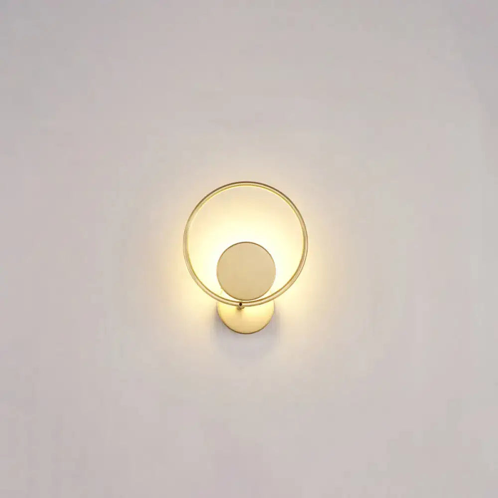 Minimalist gold metal led sconce wall mounted lamp with circular frame and concentric design for bedroom