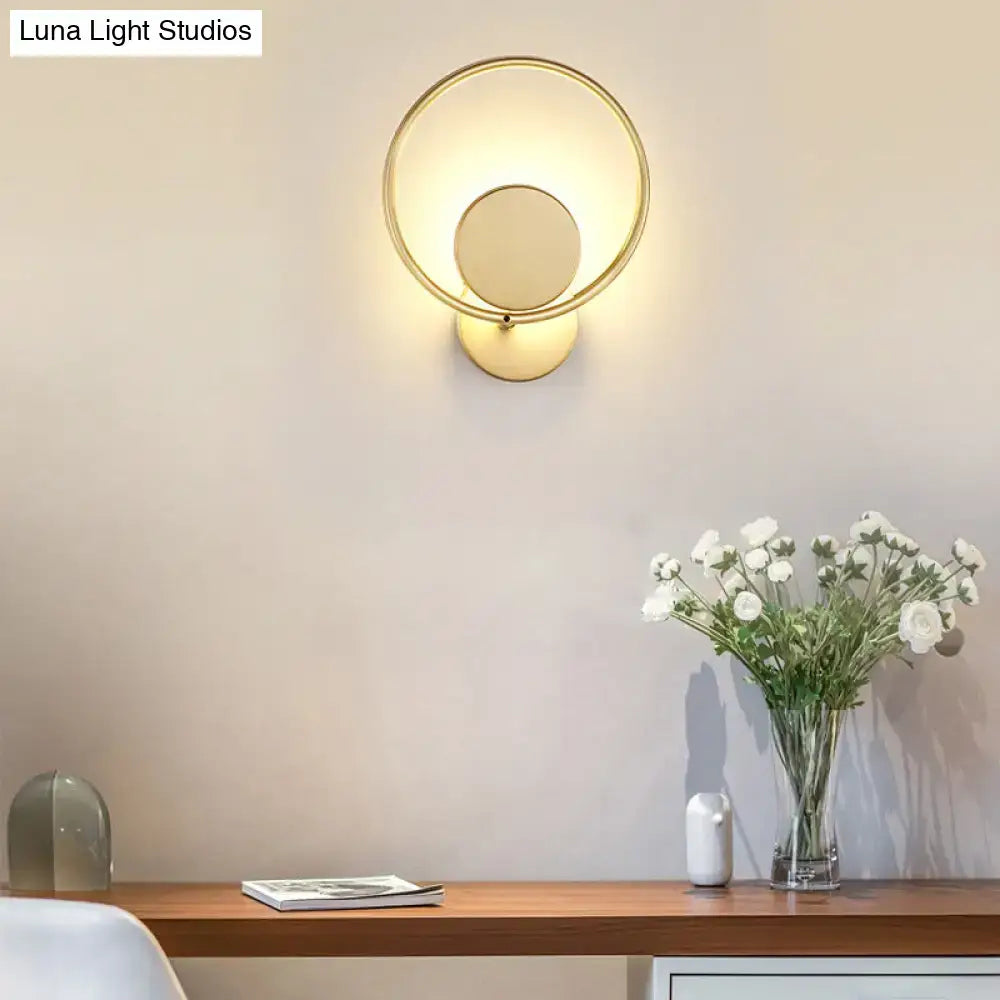 Minimalist gold metal led sconce wall mounted lamp with circular design and warm diffused lighting for bedroom