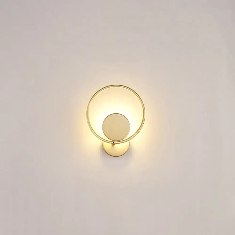 Minimalist gold metal led sconce wall mounted lamp with circular concentric rings and warm lighting for bedroom