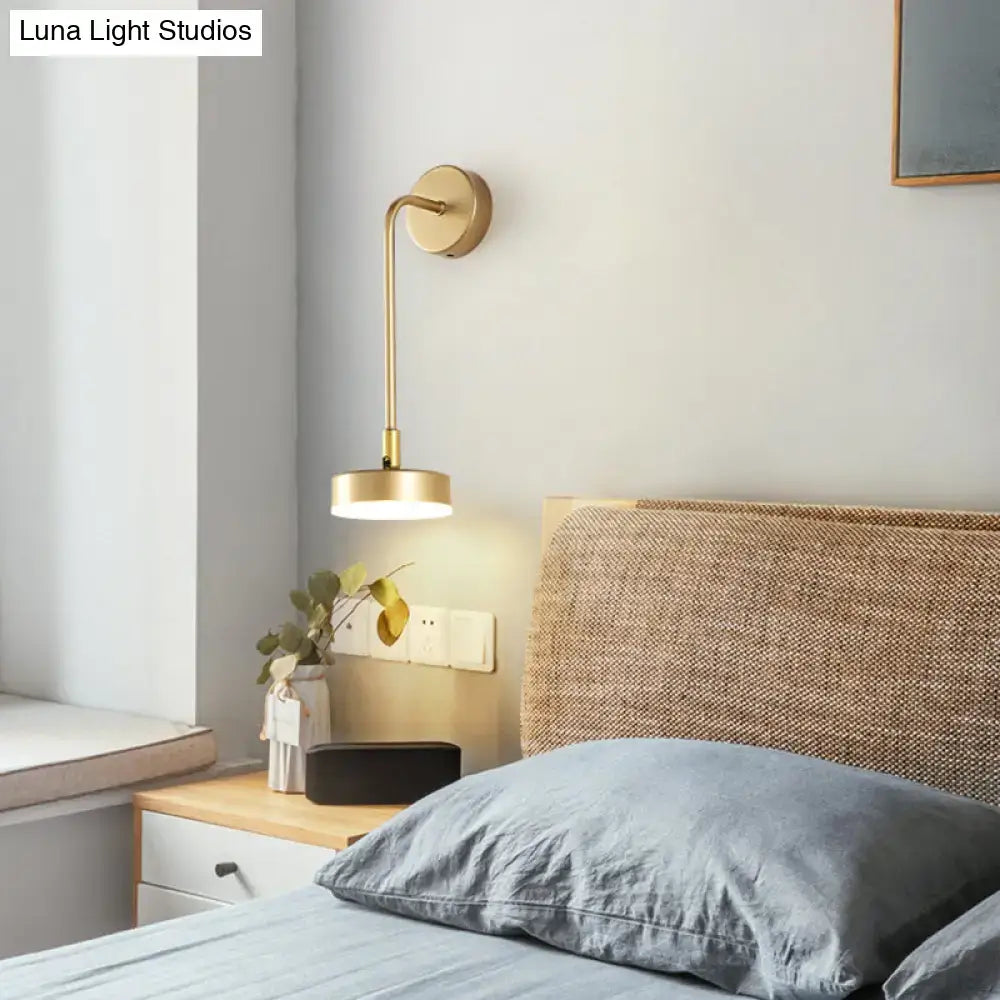 Minimalist gold metal led sconce wall mounted lamp with sleek curved arm and circular shade for bedroom lighting