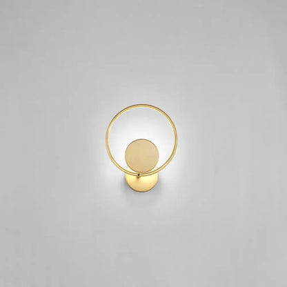 Minimalist gold metal led sconce wall mounted lamp featuring a circular ring and concentric disc design for bedroom