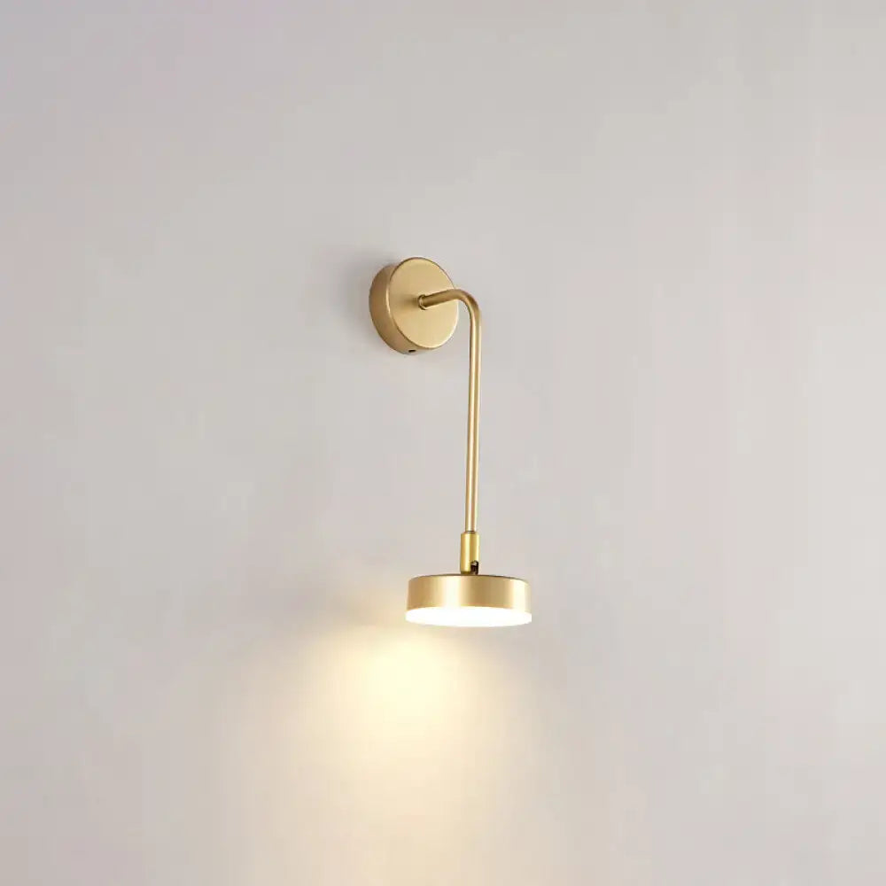 Minimalist gold metal led sconce wall mounted lamp with slender curved arm and warm ambient light for bedroom
