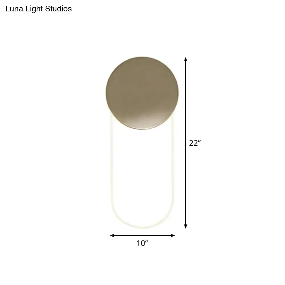 Minimalist gold metal wall lamp with matte bronze circular top and translucent cylindrical body light fixture for bedroom