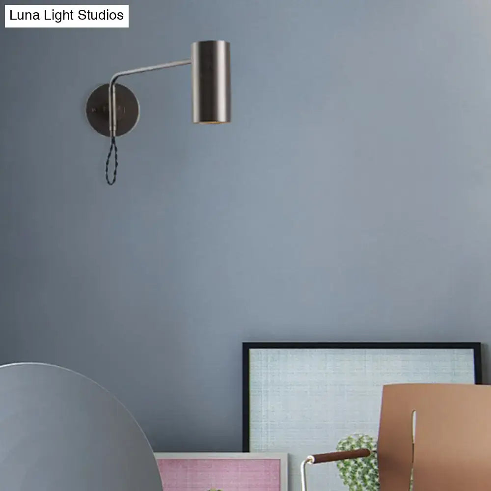 Modern minimalist gold metal wall lamp with brushed metal bedside spotlight and cylindrical shade for bedroom use