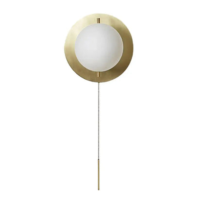 Brass-finished gold mini globe wall sconce with frosted glass globe and pull chain for minimalist bedroom lighting
