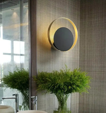 Minimalist gold-tonic nordic led wall sconce with black central disc for bedroom lighting by decorbites gold nordic
