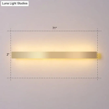 Minimalist gold plated led wall sconce with sleek rectangular design and warm ambient lighting for living room or bar