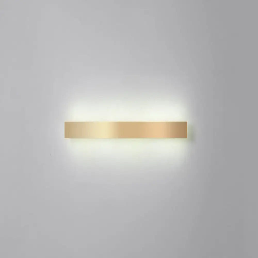 A minimalist gold plated led wall sconce with a sleek rectangular design and smooth metallic finish for living rooms